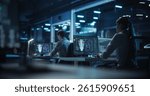 Computer Engineering Team Working in a Research Center on Quantum Hardware Development, Analyzing Data in an Industrial Laboratory. Diverse Specialists Focusing on Future Technology