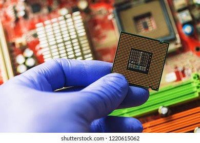 Computer Forensics Investigator Installing Old Cpu On Computer Motherboard To Recover Machine And Lost Data, Close Up Of Hand