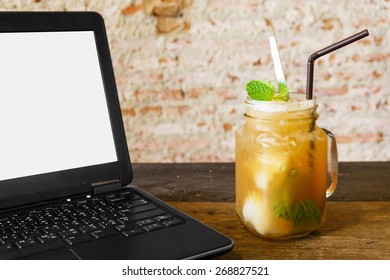 Computer and fruit tea