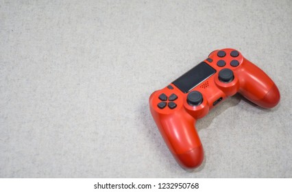 Computer game controller on textured grey background. Gaming concept.