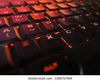 Computer Gaming Keyboard Illuminated RGB Red/Orange lights for technology background