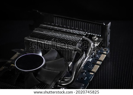 Computer graphic videocard over dark background