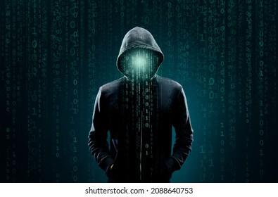 Computer hacker in hoodie. Obscured dark face. Data thief, internet fraud, darknet and cyber security concept. - Shutterstock ID 2088640753