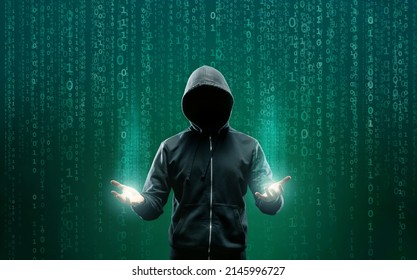 Computer Hacker in Hoodie. Obscured Dark Face. Hacker Attack, Virus Infected Software, Dark Web and Cyber Security Concept . - Shutterstock ID 2145996727