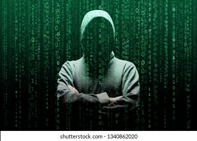 Computer hacker in mask and hoodie over abstract binary background. Obscured dark face. Data thief, internet fraud, darknet and cyber security. - Powered by Shutterstock