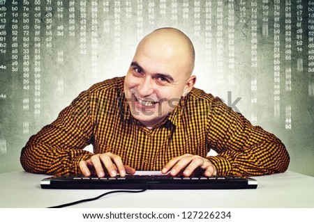 Computer hacker sitting at the table with keyboard in front of the monitor. Heartbleed bug concept,