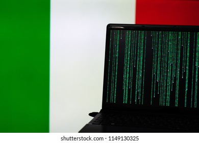 computer hacking in front of flag