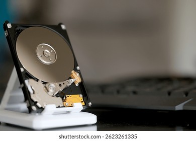 computer hard disk in close-up, disassembled, view inside, computer memory disk