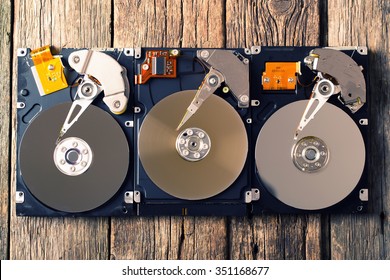 Computer hard drive on wooden background