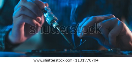 computer hardware engineering. technology science concept. developer soldering electronic component