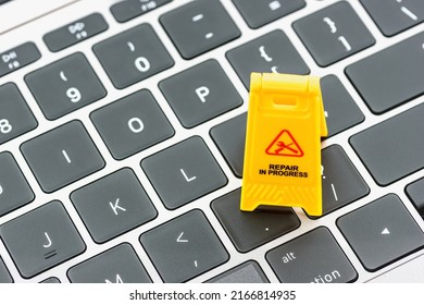 Computer Hardware Service And Maintenance Concept : Yellow Alert Or Warning Sign 