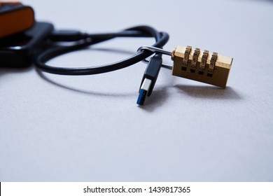 Computer or internet security. Data protection concept: external hard drive and lock