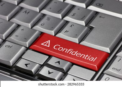 Computer Key - Confidential With Exclamation Point And Triangle 