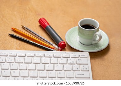 
COMPUTER KEY PEN AND COFFEE