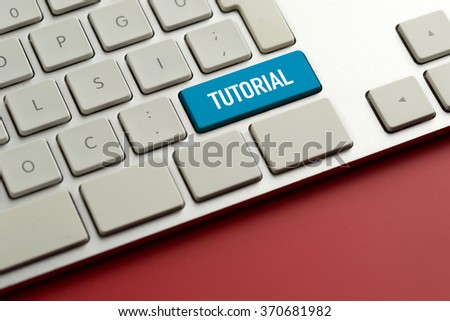 Computer key showing the word TUTORIAL