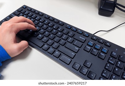 computer keyboard with backlight, on a modern desk
