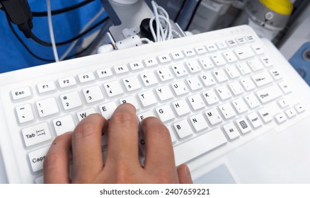 computer keyboard with backlight, on a modern desk