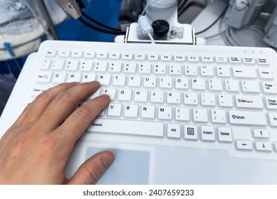 computer keyboard with backlight, on a modern desk