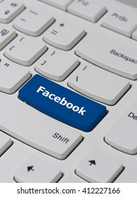 Computer keyboard button with facebook text