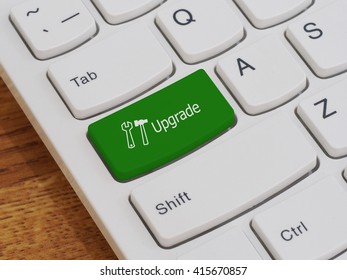 Computer keyboard button with upgrade text