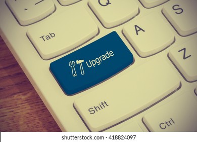 Computer keyboard button with upgrade text