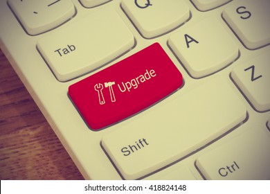 Computer keyboard button with upgrade text