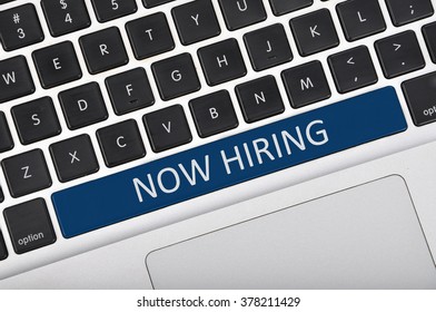 The computer keyboard button written word now hiring .