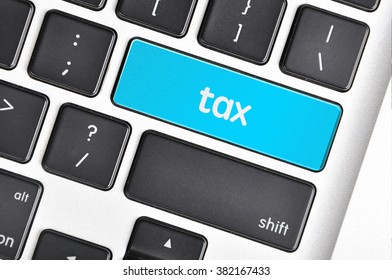 The computer keyboard button written word tax .
