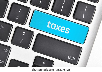 The computer keyboard button written word taxes .