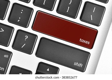 The computer keyboard button written word taxes .