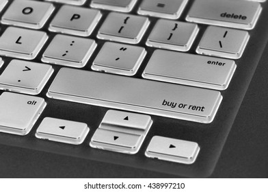 The computer keyboard button written word buy or rent .
