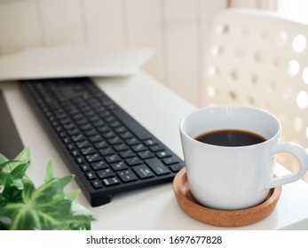 Computer keyboard  with cup of coffee