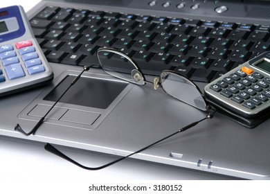 Computer keyboard glasses  calculator on a white background - Shutterstock ID 3180152