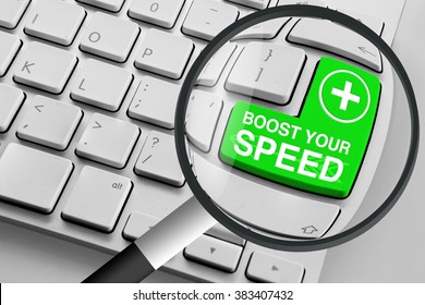 Computer keyboard with green boost your speed button and magnifying glass