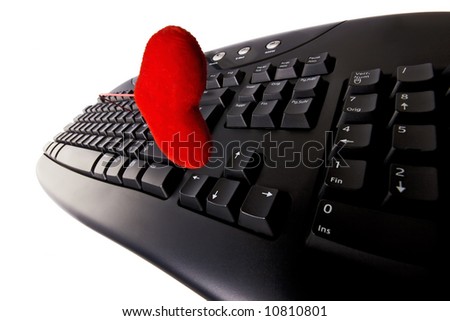 A computer keyboard and a heart isolated. Conceptual - online love, internet dating, internet relationship
