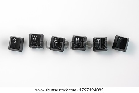 Computer keyboard keys spelling QWERTY, isolated on white background