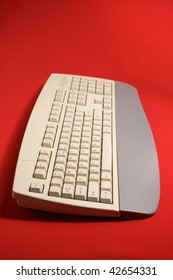 Computer keyboard on red backgrounds