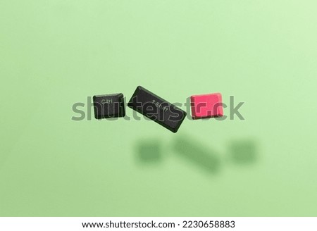 Computer keys in the air on green background
