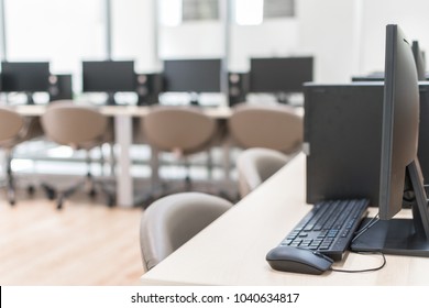 Computer Lab Blur Background With Pc Desktop Computer Machine In Blurry Empty School Class  Room Or Office Desk Interior Workspace Workplace Environment