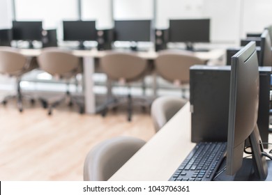 Computer Lab Blur Background With Pc Desktop Computer Machine In Blurry Empty School Class  Room Indoor Or Office Desk Interior Workspace Workplace Environment