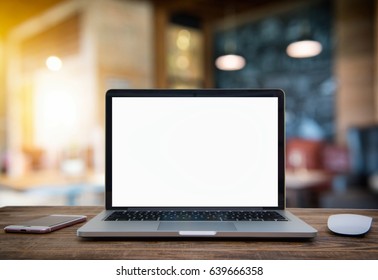 Computer Laptop with blank screen on  table of coffee shop blur background with bokeh, desk  blank work office mockup monitor