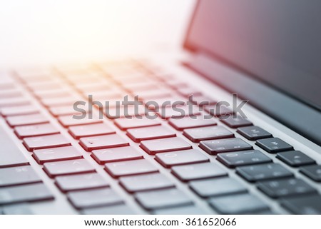 Computer laptop close up. Vintage filter