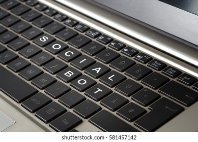 Computer Laptop Keyboard With The Words SOCIAL BOT In White Letters On Black Keys, Selected Focus, Narrow Depth Of Field