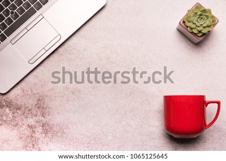 computer laptop on working table flat lay composition top view  with copy space