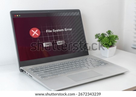 A computer laptop with operation error message. System error, file system error or critical error.