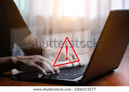 Computer laptop with triangle warning sign for error notification and maintenance concept. warning virus detected computer bug software bug