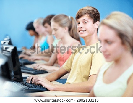 Computer, learning and portrait with boy in classroom for education, lecture or IT lesson. Teenager, high school and technology with students for programming class, online assessment or project