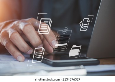 Computer login  businessman working laptop computer on virtual screen, documents with checkbox lists - Shutterstock ID 2134876327