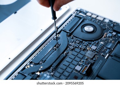 Computer Maintenance. Pc Technician Repair Service With Laptop On Hardware Background. Maintenance Engineer Support. Electronic Technology Development Concept