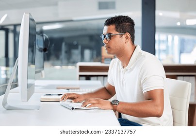 Computer, IT and man developer typing or coding in an office working on a project online, web or internet. Website, search and professional person or programmer at an agency or startup using a pc